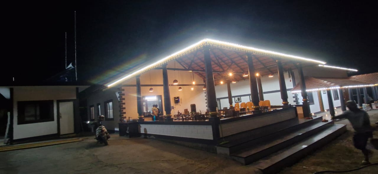 Two-story building with covered patio at night, Aqua Terra Villas - Belur, Sakleshpur