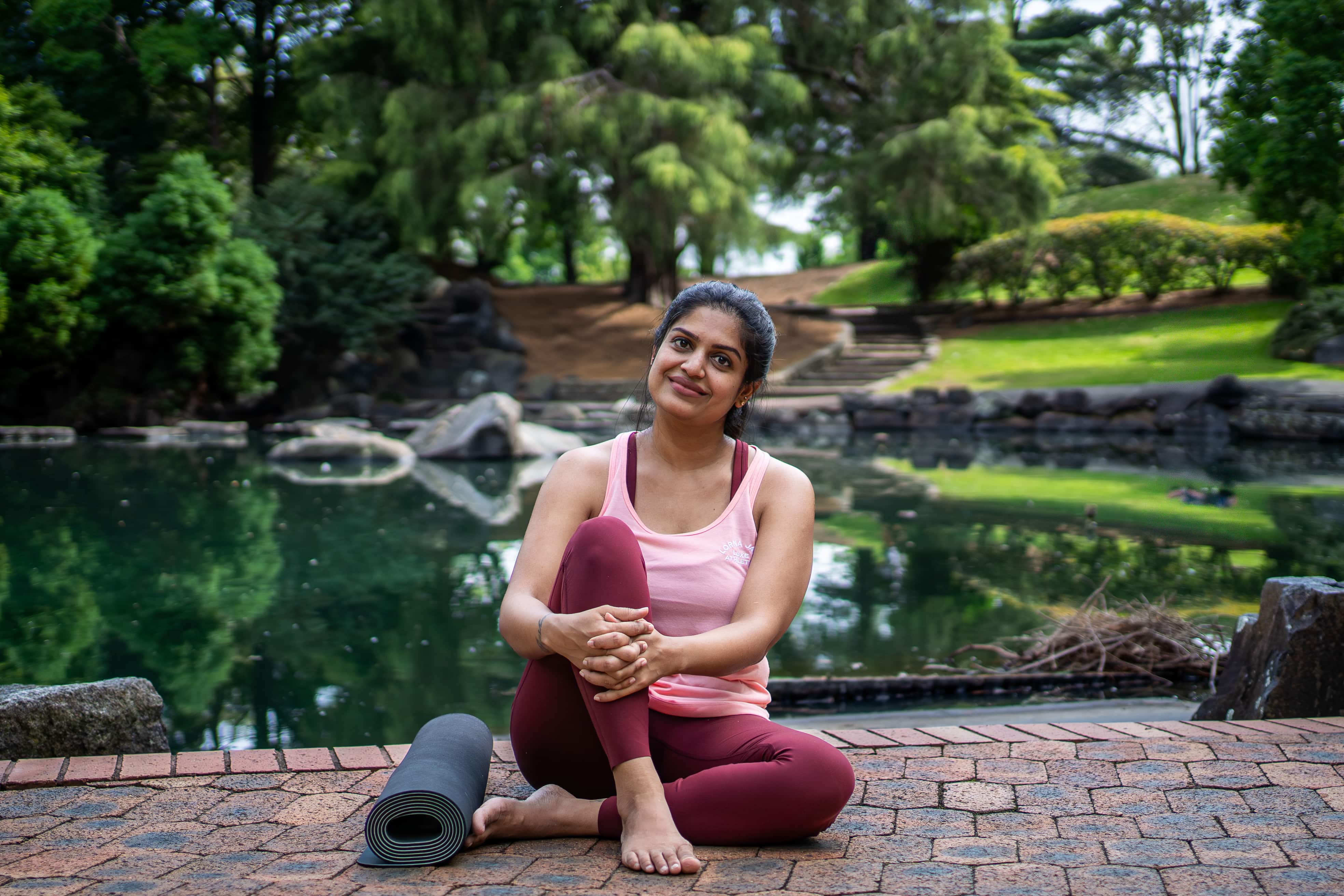 Rashmi in a calming yoga pose